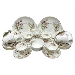 Royal Doulton Apple Blossom pattern tea service for twelve, comprising twelve saucers, twelve tea plates, twelve teacups, milk jug, sucrier and two cake plates