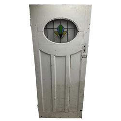 1930s external door with stained leaded glass panel (86cm x 203cm), six small stained glass windows in wooden frames (W52cm); and various loose stained leaded glass panels