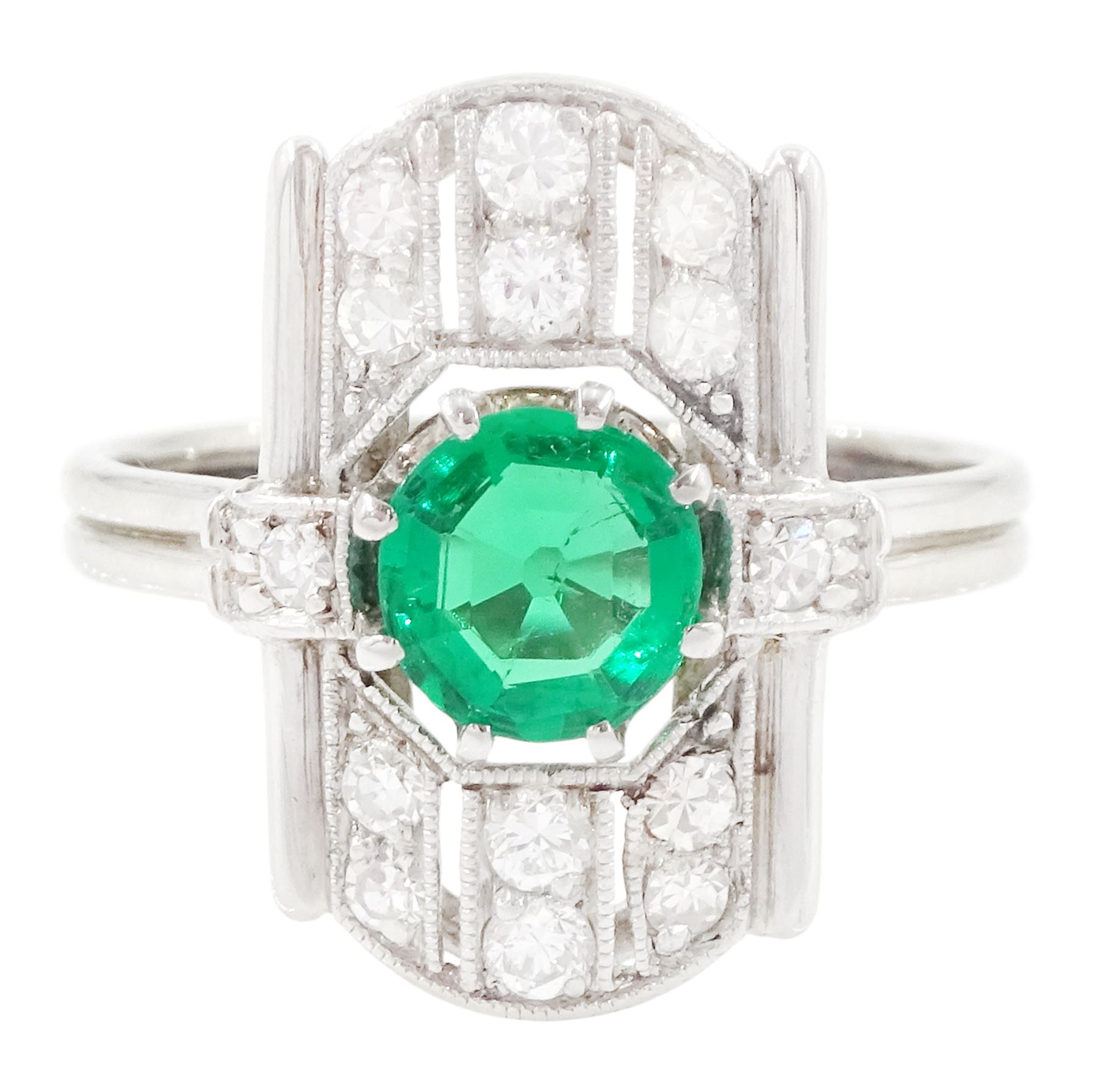 Art Deco 14ct white gold emerald and diamond panel ring, the central round cut emerald of approx 0.45 carat, within a pierced octagonal setting, flanked by a single cut diamond either side and three rows of milgrain set, single cut diamonds, to a reeded shank, stamped 585, total diamond weight approx 0.55 carat