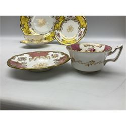 Coalport batwing pattern tea wares in rare pink and yellow colourways, comprising pink teacup and saucer, and yellow teacup trio with larger plate retailed by Mappin & Webb, all decorated with finely enamelled floral sprays within gilt reserves, all with green Coalport AD 1750 marks beneath, no Y2665, largest D22cm