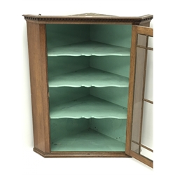  Georgian oak wall hanging corner cabinet, single door enclosing three shaped shelves, W79cm, H95cm, D43cm  