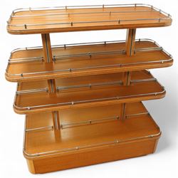 Mid-20th century retail display stand, of stepped rectangular tiered form with four graduated adjustable shelves, each with rounded corners and fitted with tubular chrome safety rails, supported by central chrome-mounted wooden uprights over a plinth base