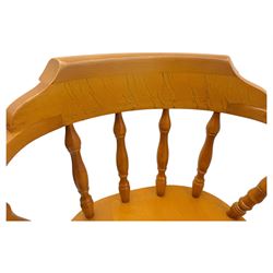 Pair of late 20th century beech bar stools, with curved top rail and turned spindle back, shaped seat over four turned legs united by multiple stretchers