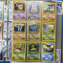Collection of approximately 400 Pokemon trading cards, mostly 1999 Wizards Pokemon cards to include 1st Edition Dark Gyarados holo 8/82, Dark Charizard 4/82 holo and 21/82 non holo, Dark Blastoise 3/82 holo and 20/82 non holo, Dark Raichu holo 83/82, Dark Dragonite 22/82, eleven first edition cards, Japanese cards, Trainer cards, etc, together with an album of Pokemon the First Movie cards, a voice actor signed copy of Pokemon: The First Movie Animation Comics Mewtwo Strikes Back #1, 5305/8000 with certificate of authenticity with comics 2, 3 and 4 