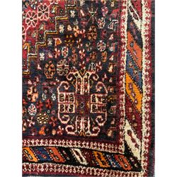 Persian red ground rug carpet, central diamond medallion, multicoloured chequered border