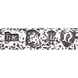 Late 19th century German Hanau silver box, of shaped rectangular form, embossed throughout, the hinged cover decorated with a central oval panel depicting a genre scene with musicians, the corners detailed with masks, the sides detailed with conforming figures and musical trophies, opening to reveal a gilt interior, with Hanau marks for Neresheimer & Sohne, and hallmarked B Muller & Son, London import 1907, approximate weight 3.32 ozt (103.4 grams)