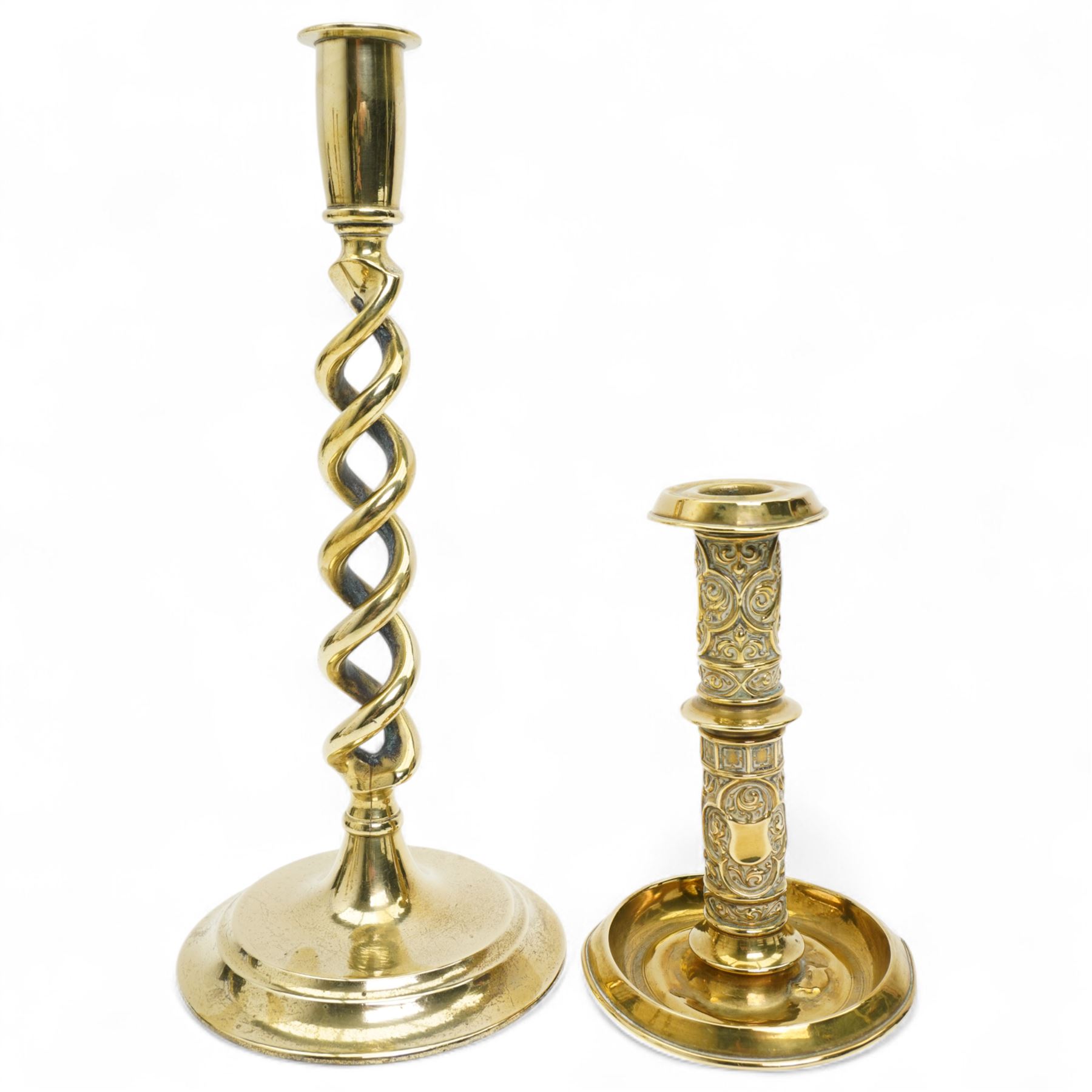 Early 20th century brass 'Mr Punch' doorstop H29cm, another 'Judy' H28cm, pair of brass Jack of Diamonds brass candlesticks H36cm, two other candlesticks and a chamber stick (7)