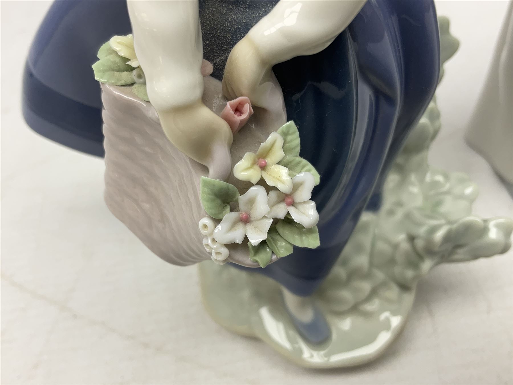 Four Lladro figures, comprising Pulling Dolls Carriage no 5044, Belinda with her Doll no 5045, Pretty Pickings no 5222 and Shepherdess with basket no 4678 