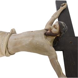 Eight crucifixes with Corpus Christi, various ages and materials, including wood and medal examples, largest H120cm 