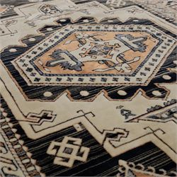 Two rugs, small Bokhara-type rug, terracotta ground with repeating hooked lozenge medallions enclosed by geometric borders (H 120cm, W 83cm); and a cream-ground rug, central lozenge medallion with geometric spandrels and border motifs (H 145cm, W 101cm),