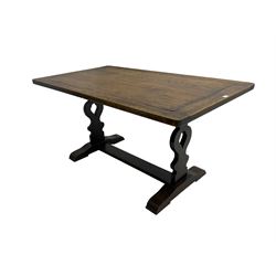 Oak dining table, rectangular top raised on shaped and pierced supports united by stretchers, on sledge feet