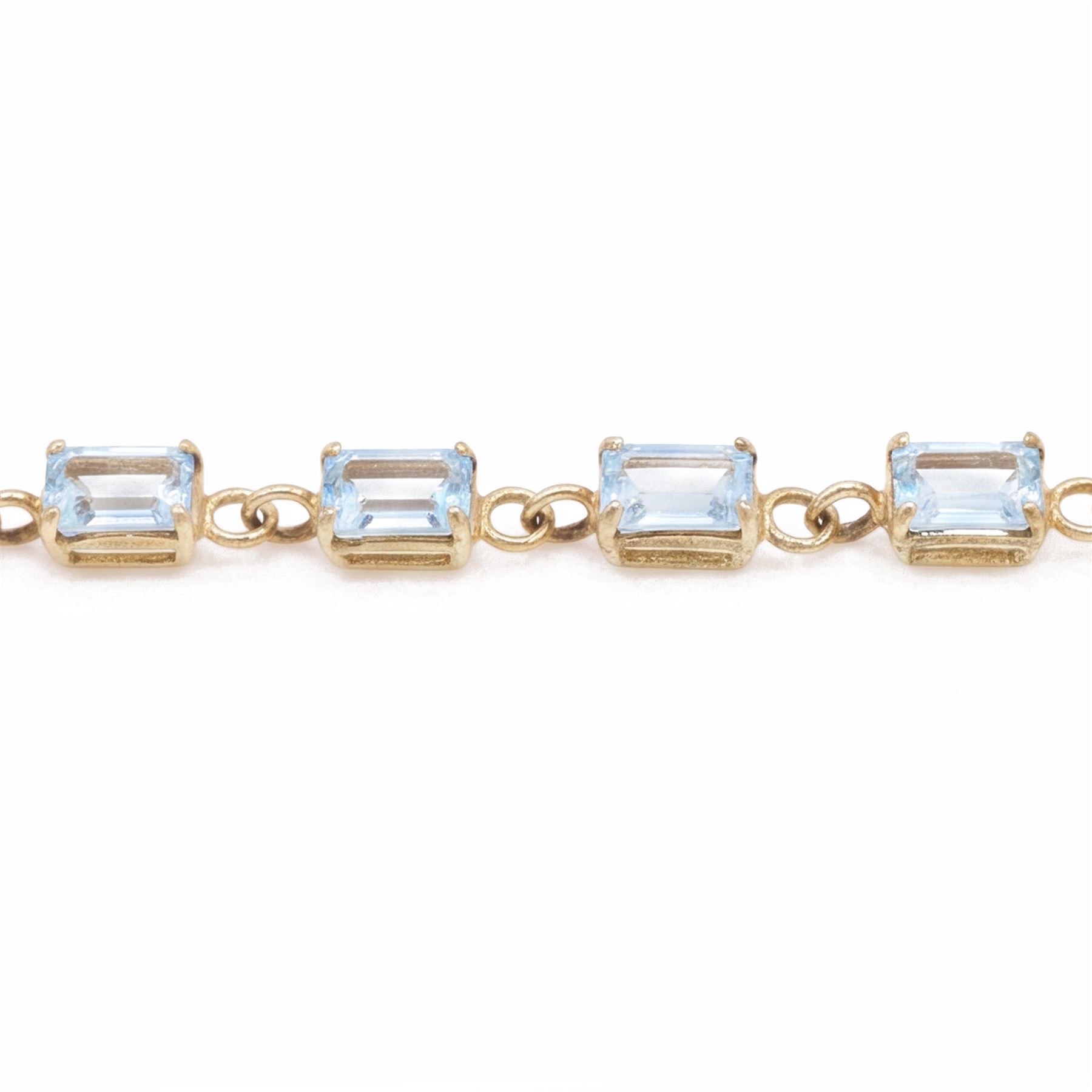 9ct gold Swiss blue topaz bracelet, set with thirteen rectangular cut topaz's, hallmarked