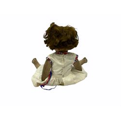 1920s Chad Valley 'Bambina' doll, the pressed felt head with applied hair, side glancing inset glass eyes, painted facial features and velvet jointed body, Hygenic and Bambina labels to the feet H46cm
