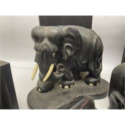 Three pairs of carved wooden elephant bookends, and a similar carved wooden elephant figure, tallest H24cm