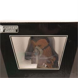 Four Gentle Giant Star Wars busts, comprising 2014 Premier Guild Exclusive Wedge Antilles Deluxe Mini Bust, 2013 Convention Exclusive C-3PO McQuarrie Concept, Finn and Preview Exclusive Chewbacca Mynock Hunt, together with a Master Replicas 501st Legion Clone Trooper Helmet Scaled Replica, all boxed