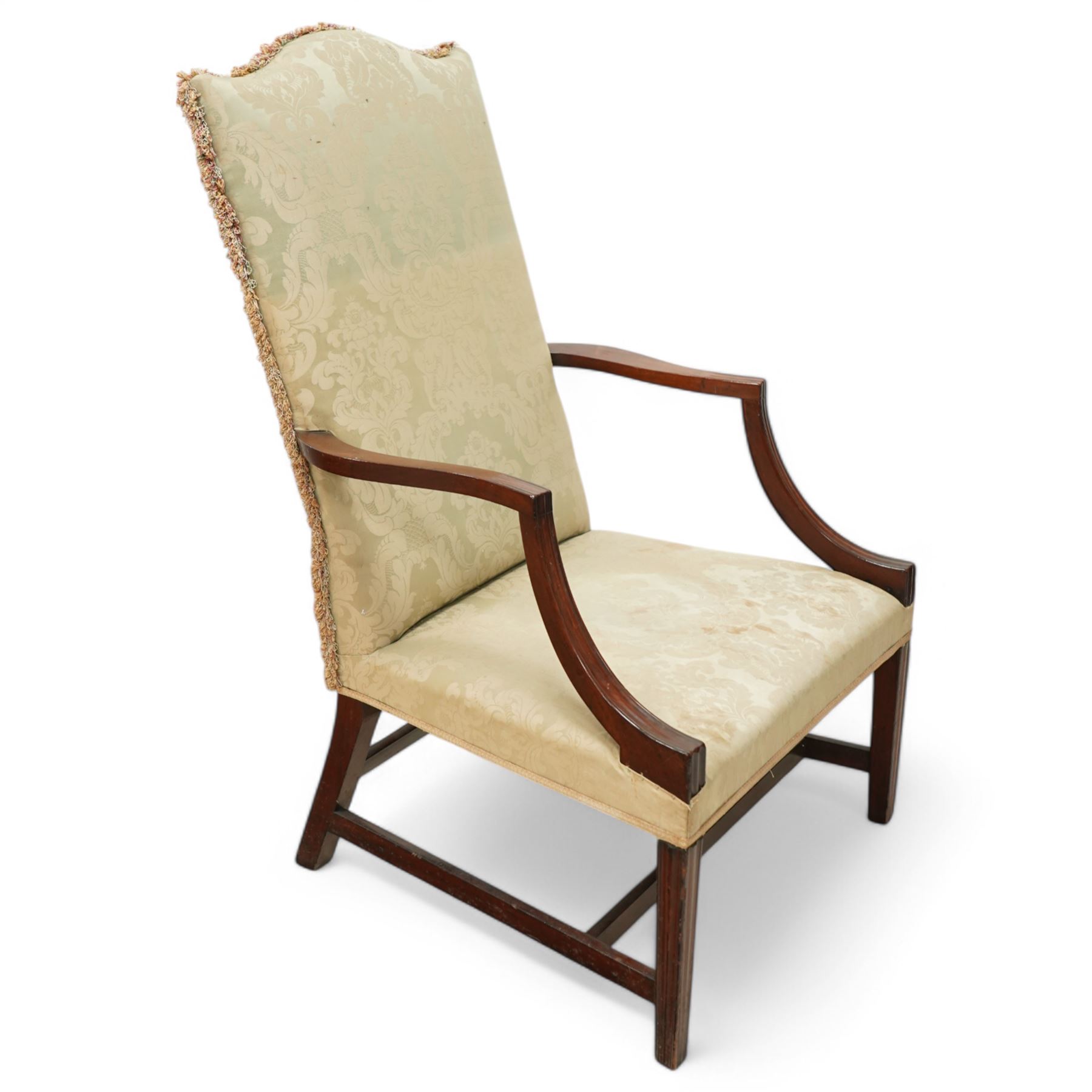 Georgian design mahogany framed Gainsborough armchair, arched cresting rail over shaped arms on curved and moulded supports, upholstered in pale green fabric with repeating foliate pattern, on square tapering moulded supports united by plain stretchers 