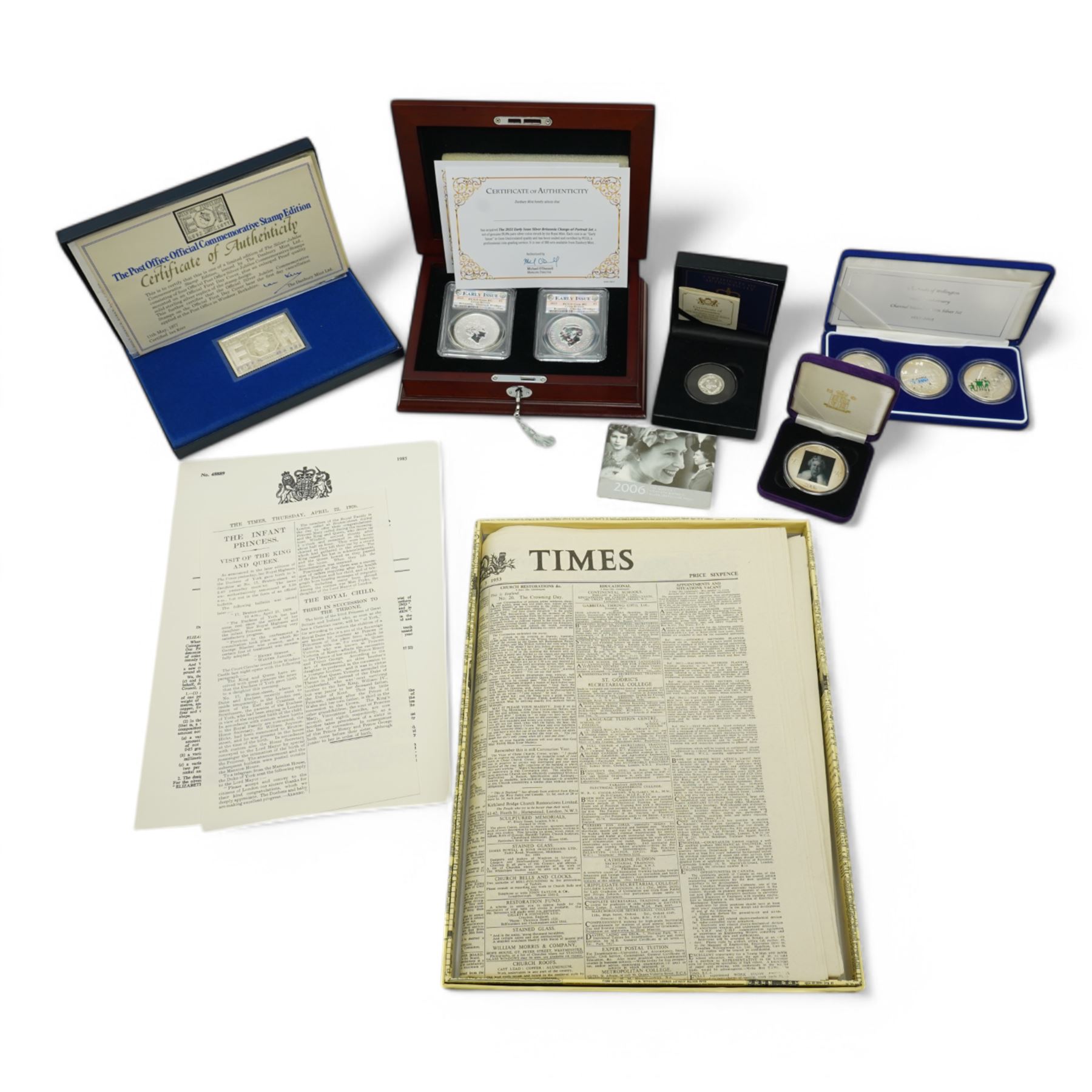 Queen Elizabeth II 'Silver Jubilee' hallmarked sterling silver commemorative stamp ingot, Channel Islands 2002 'The Duke of Wellington' silver three coin set, 2006 'The Queen's Eightieth Birthday Silver Lenticular Medal', Isle of Man 2021 'Silver Proof Sovereign', Danbury Mint 'The 2023 Early Issue Silver Britannia Change-of-Portrait Set', all cased with certificates and a facsimile newspaper etc