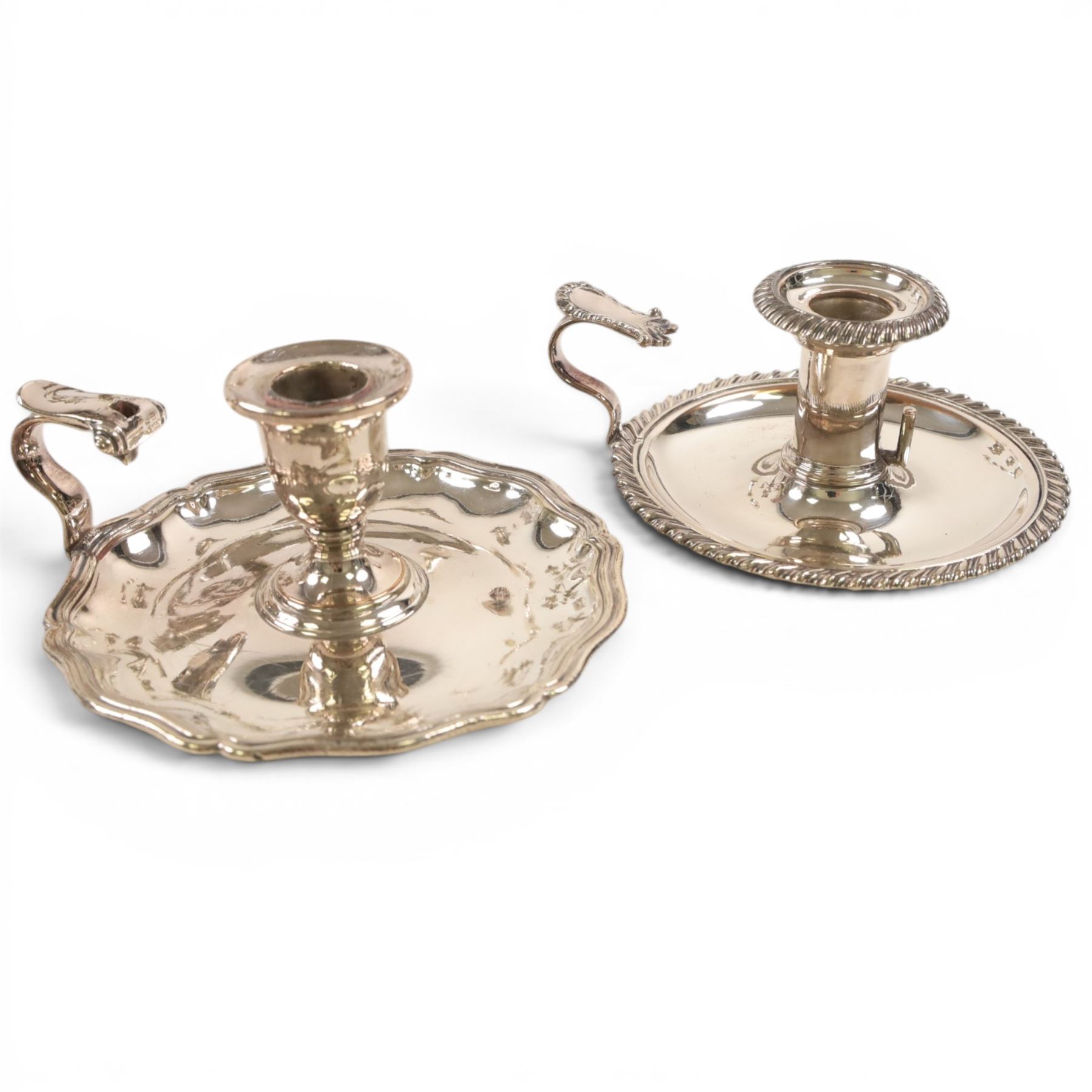 Silver plate two branch candelabra with grape vine decoration to the base, together with a matching pair of candle sticks and other candlesticks  