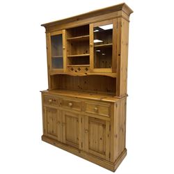 Traditional pine dresser, the rack fitted with two shelves flanked by glazed cupboards, the base with three drawers over three panelled cupboards