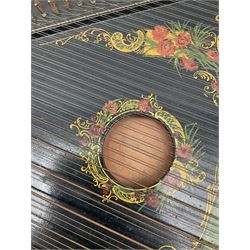 Late 19th/early 20th century zither of typical ebonised form decorated with a panel of a lady playing a harp, flowers etc L54cm, cased