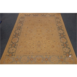  Persian style gold ground rug, floral field, repeating border, 278cm x 228cm  
