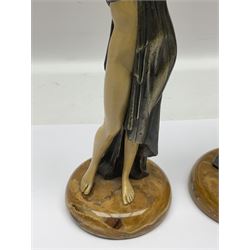 After Ferdinand Preiss (1882-1943), pair of Art Deco style, composite semi nude classical female figures, raised on circular onyx bases, H21cm