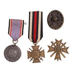 WWI German Hindenburg cross, together WWII bronze Merit Cross with crossed swords, Luftschutz Civil Defence medal and German Wound Badge 
