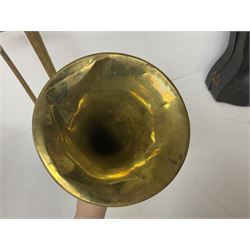 Three brass trombones comprising Elkhart Ind. USA 'CONN' model no.72H; Besson 'Concord'; and Selmer Distributed 'Lincoln'; two in carrying cases; and German B & M 'Champion' brass trumpet (4)