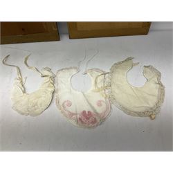 Late 18th century sampler worked with the alphabet above verses in red, by Mary Birkett aged 10 November 16th 1792, H33.5cm W34.5cm, together with another sampler worked with the alphabet above Proverbs 14:23, by Mary Anne Hainworth, Chesham, date unknown (--83), both in glazed frames, together with a quantity of Victorian and later dolls clothes to include lace examples