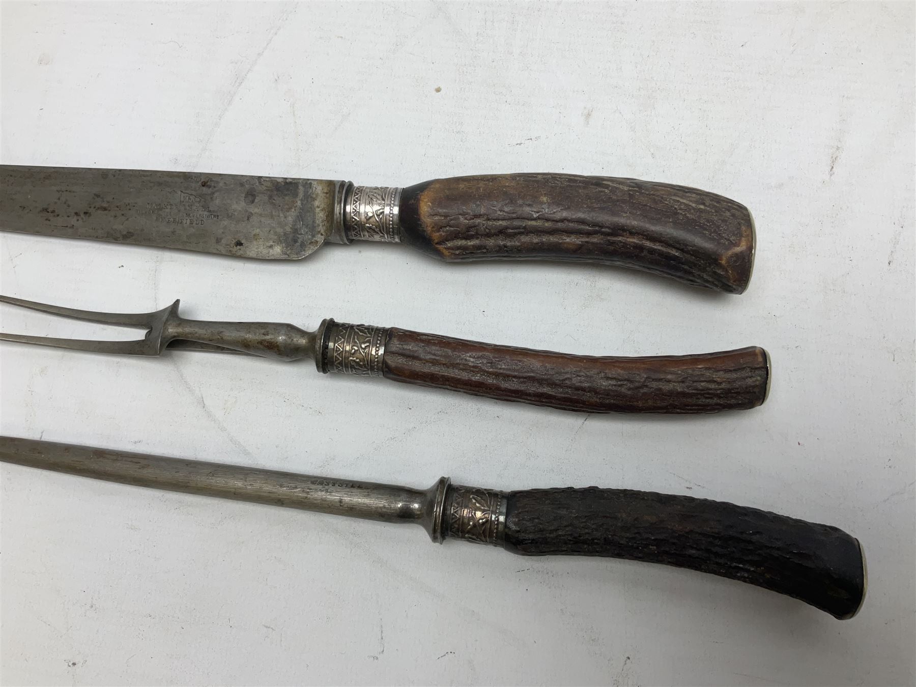 Early 20th century Indian wooden fish scabbard knife and fork serving set, together with other carving instruments with antler handles to include a Walker & Hall example