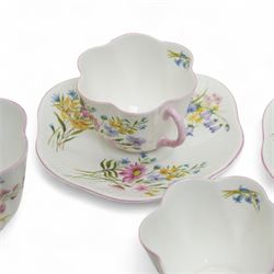 Shelley 'Wild Flowers' pattern part tea service, comprising four coffee cups, five coffee cup saucers, nine teacups, eight teacup saucers, coffee pot, three milk and cream jugs, two bowls, five cake plates etc