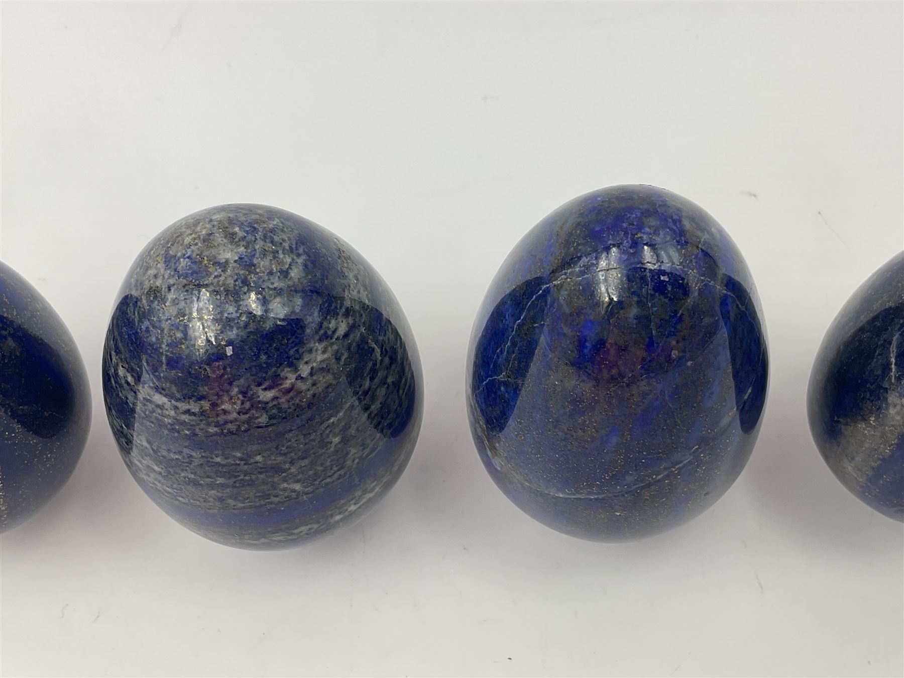 Collection of five Lapis lazuli specimen eggs, largest egg H7cm