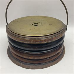  Georgian circular footwarmer with turned wood with decorative ebonised band, brass cover and swing handle, D25cm