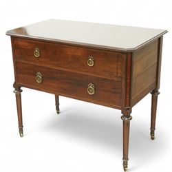 Early 20th century Regency-inspired mahogany two-drawer chest, rectangular top with moulded edge and shaped corners, above two full-width graduated drawers with ring handles, supported on turned tapered legs with brass castors                                                                                                                                                      