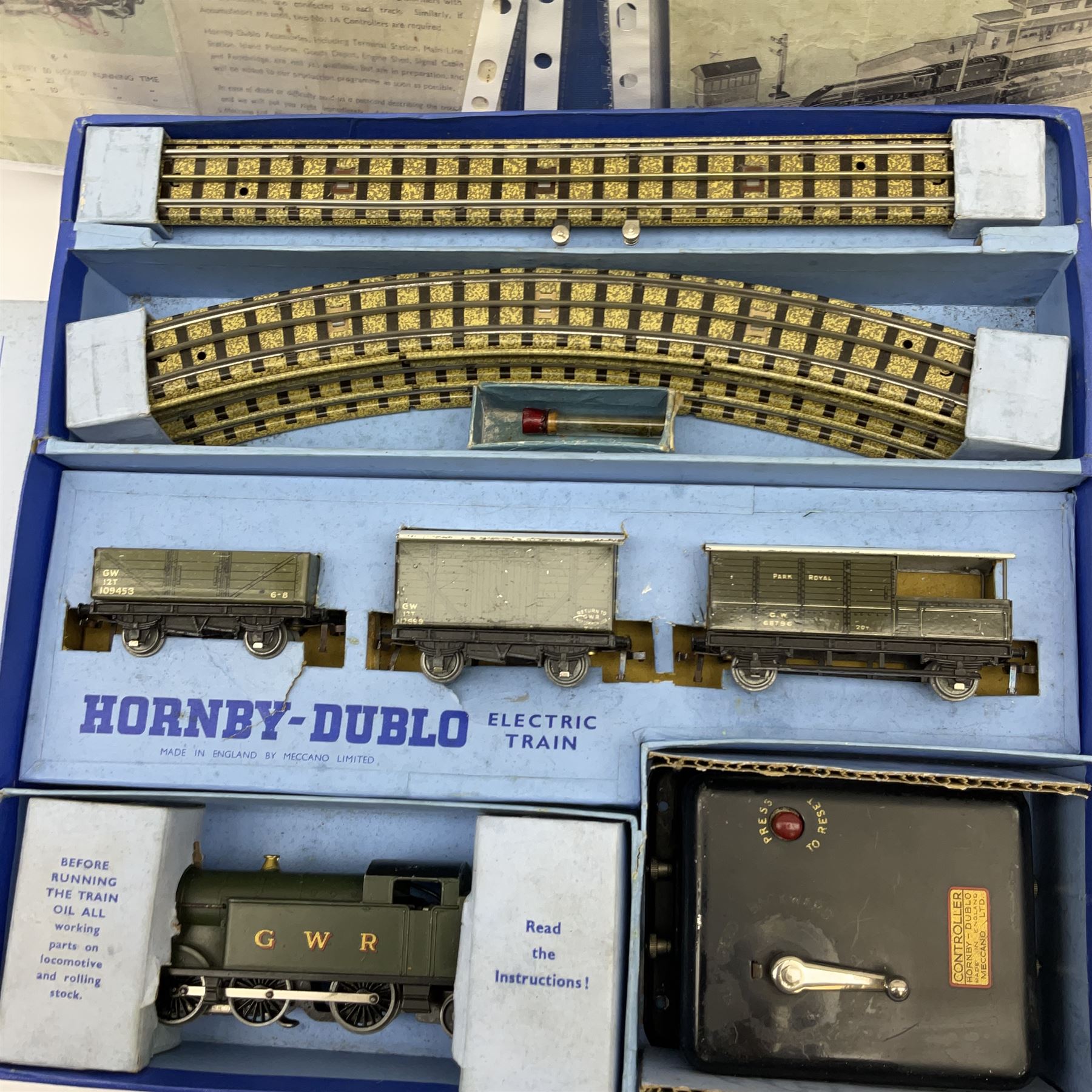Hornby Dublo - three-rail EDG7 Tank Goods Train set with GWR 0-6-2 Tank locomotive No.6699, two wagons and brake van, quantity of straight and curved track and controller, boxed with instructions and oil bottle.