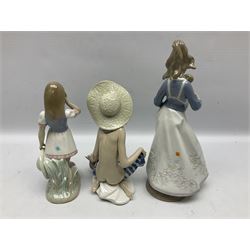 Three Lladro figures, comprising Modern Mother no 5873, Dropping the Flowers no 1285 and On the Beach no 1481, all with original boxes, largest example H30cm