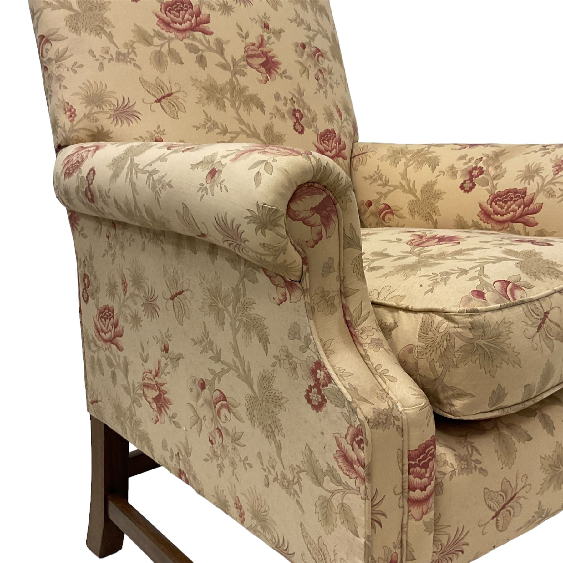 Peter Dudgeon - Georgian design mahogany framed armchair, shaped cresting rail over sprung back and seat flanked by rolled arms, upholstered in floral patterned fabric with matching seat cushion, on square supports joined by stretchers
Provenance: From the Estate of the late Dowager Lady St Oswald