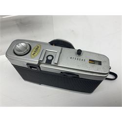 Olympus Pen-EE camera, serial no 415299, with Olympus D.Zuiko 1:3.5 f=2.8cm lens, together with four Olympus Trip 35 cameras, serial nos 4759245, 4257589, 1847727 and 5387611, each with Olympus D. Zuiko 1:28 f=40mm lenses