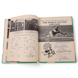 'World Cup 1966 England' hardback book, signed to inner front page by thirteen legendary footballers, to include Bobby Moore, Pele, George Cohen, Bobby Charlton, Alan Ball, Nobby Stiles, Roger Hunt, Peter Thompson, Kenneth Wolstenholme, Jairzinho, Garrincha, Martin Peters and Geoff Hurst, with certificate of authenticity from Chaucer Auctions