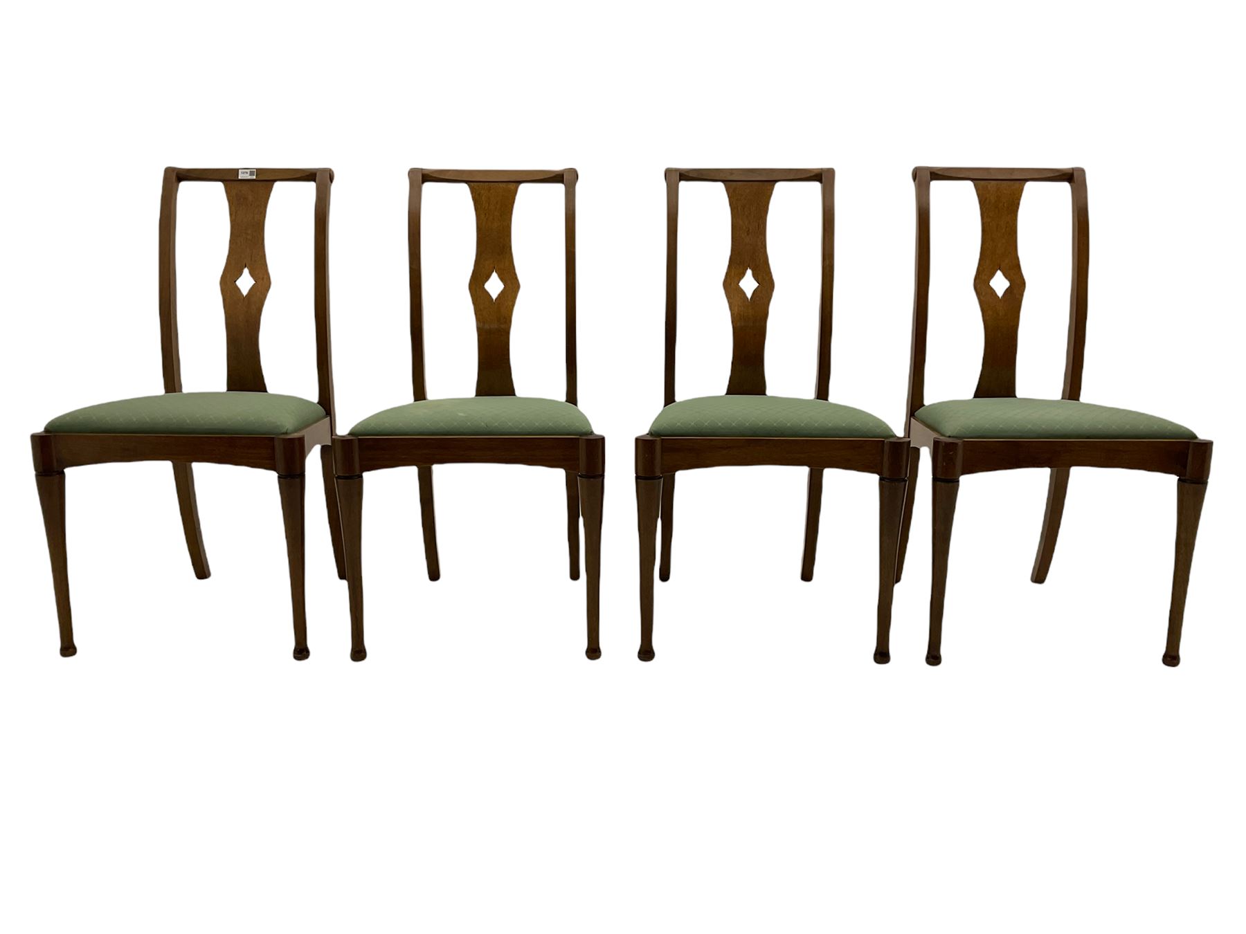 Set of eight contemporary walnut dining chairs, curved backs set with shaped splats with pierced detail, drop in upholstered seat cushions, on turned supports 