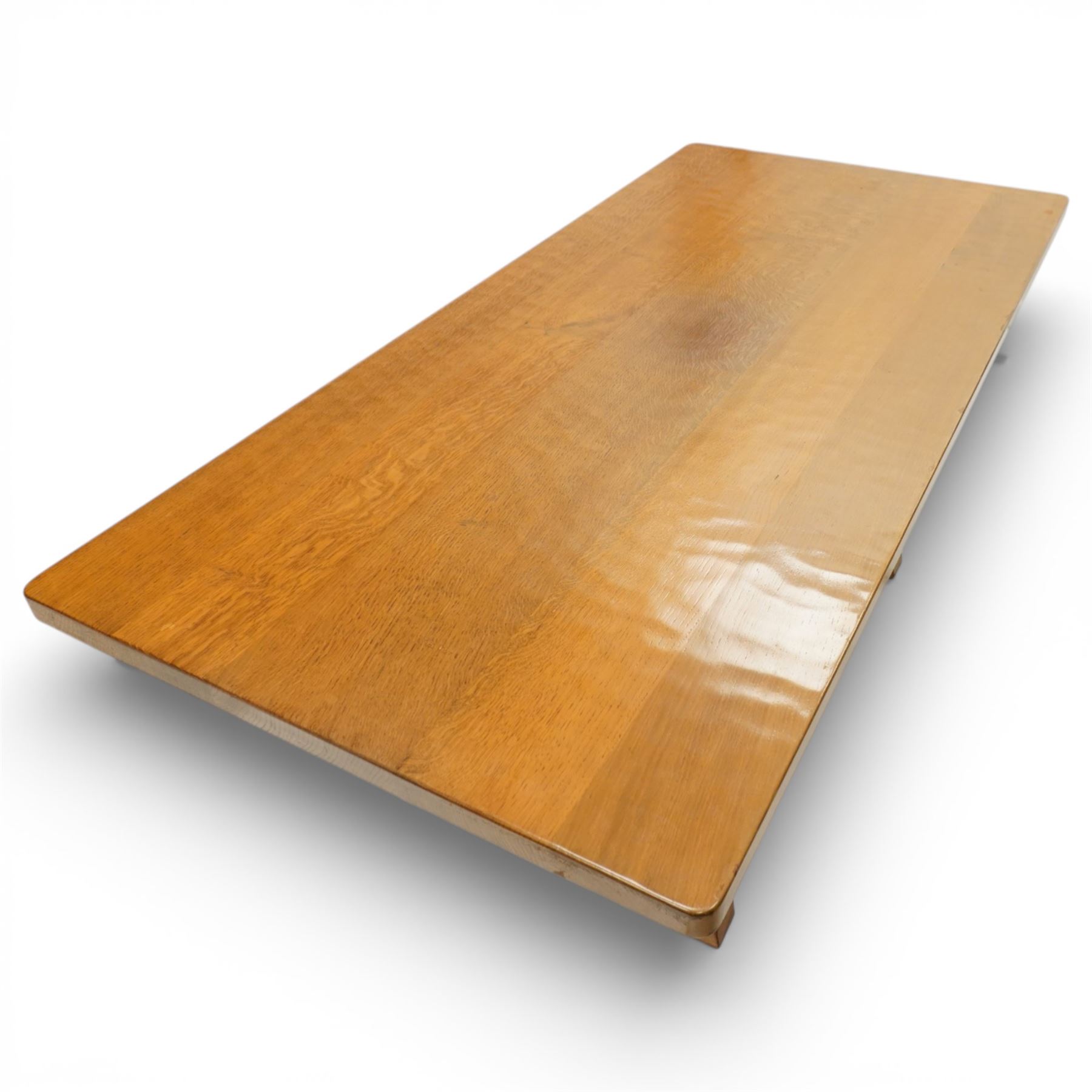 Beaverman - oak adzed top refectory table, the rectangular top raised on twin trestle supports with shaped feet united by a stretcher, the joints secured with exposed pegs, with carved beaver signature, by Colin Almack of Sutton near Thirsk