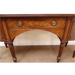  Regency break front figured mahogany sideboard, moulded top, single frieze drawer flanked by two convex cupboards, turned lobe tapering supports, W175cm, H92cm, D68cm  