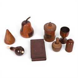 Group of treen, comprising, Mauchline ware coin box, box modelled as pear, egg cup, butter...
