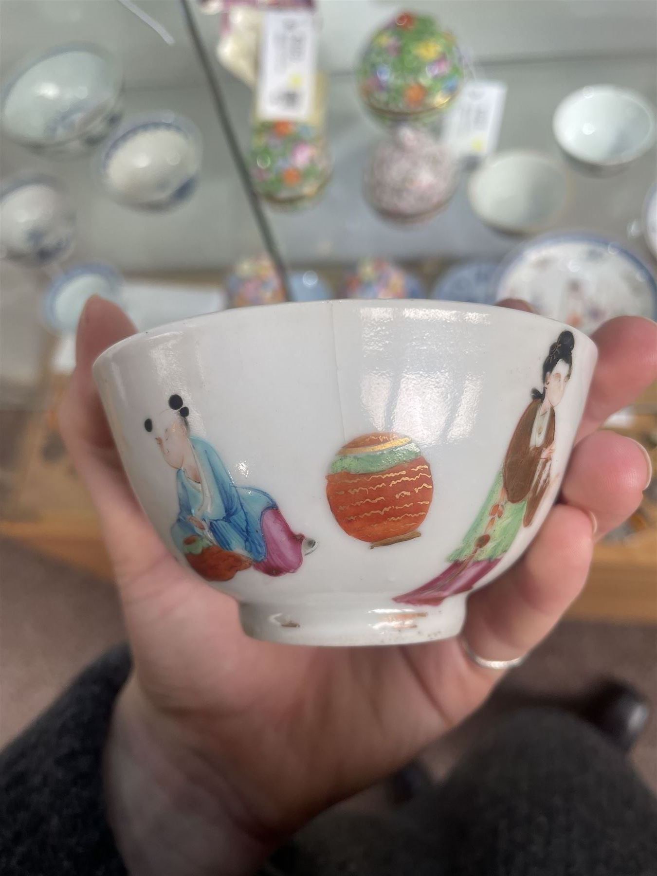 Group of eight 18th century and later Chinese famille rose and similar painted teabowls and dishes, to include unmarked peony cup, small cup decorated with flowers and butterfly, cup decorated with female figure gazing out of a window in a Buddhist temple with indistinct square character mark to base, pair of saucers unmarked, and others with character scenes unmarked (8)