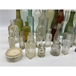 Collection of various vintage glass bottles and stoppers, including advertising bottles, sauce bottles and medical bottles etc