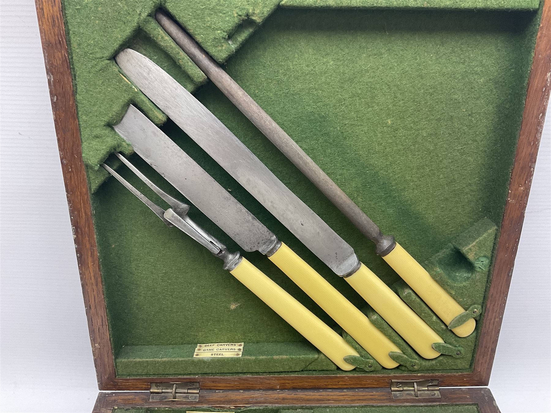 Walker and Hall silver plated canteen of cutlery, oak case, the hinged lid with a engraved brass shield , H12cm, L32cm
