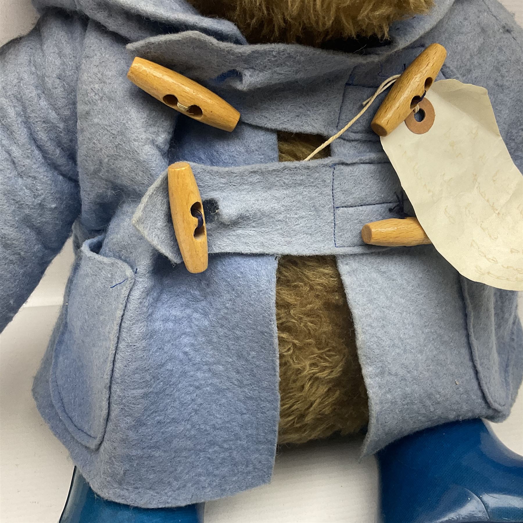 Paddington Bear with plush covered body, brown felt hat, pale blue duffle coat and blue wellingtons H54cm
