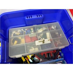 Lego - large quantity of part-built models and loose component parts including Lego Technic and Lego System, space and road vehicles, ships and boats, helicopter etc; together with two set boxes and folder  containing large quantity of instruction booklets; stored in two very large plastic boxes