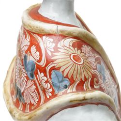 Large Japanese Imari porcelain figure, modelled as a Bijin, wearing a long kimono decorated with apple blossom and leafy branches on a white ground, with gilt detailing, possibly Edo period, H63cm