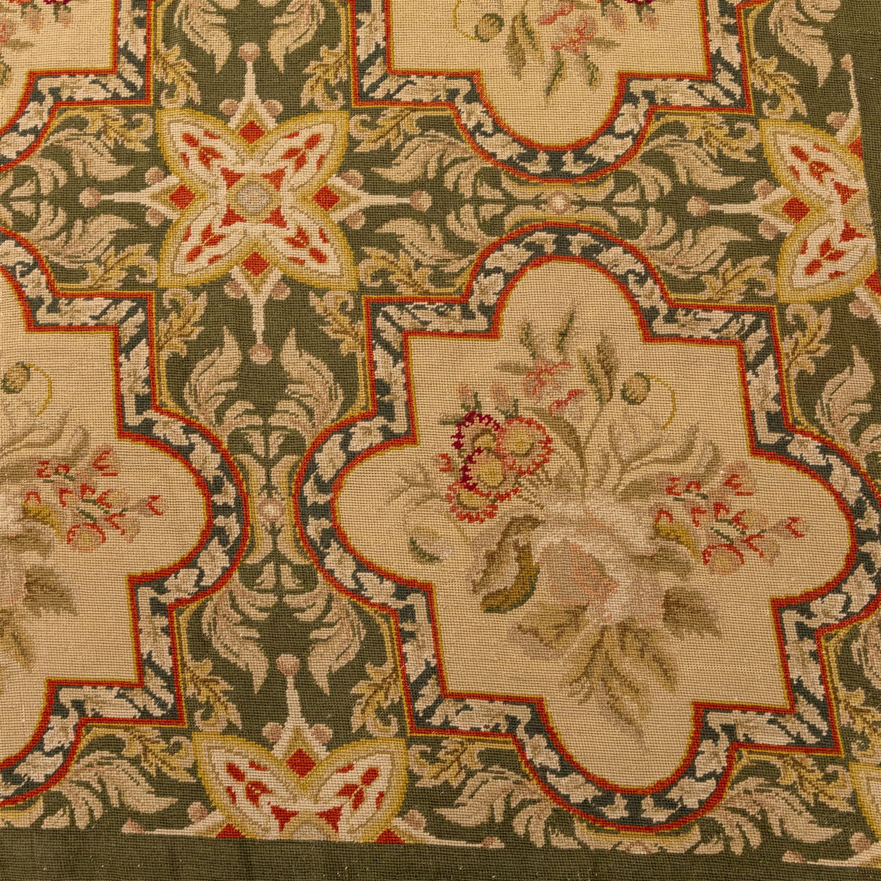 Late 20th-century Aubusson-style woven tapestry of rectangular form, woven with an all-over repeating arrangement of cream quatrefoil cartouches, each enclosing a stylized floral spray with an olive green scrolling foliate ground, interspersed with star motifs 
